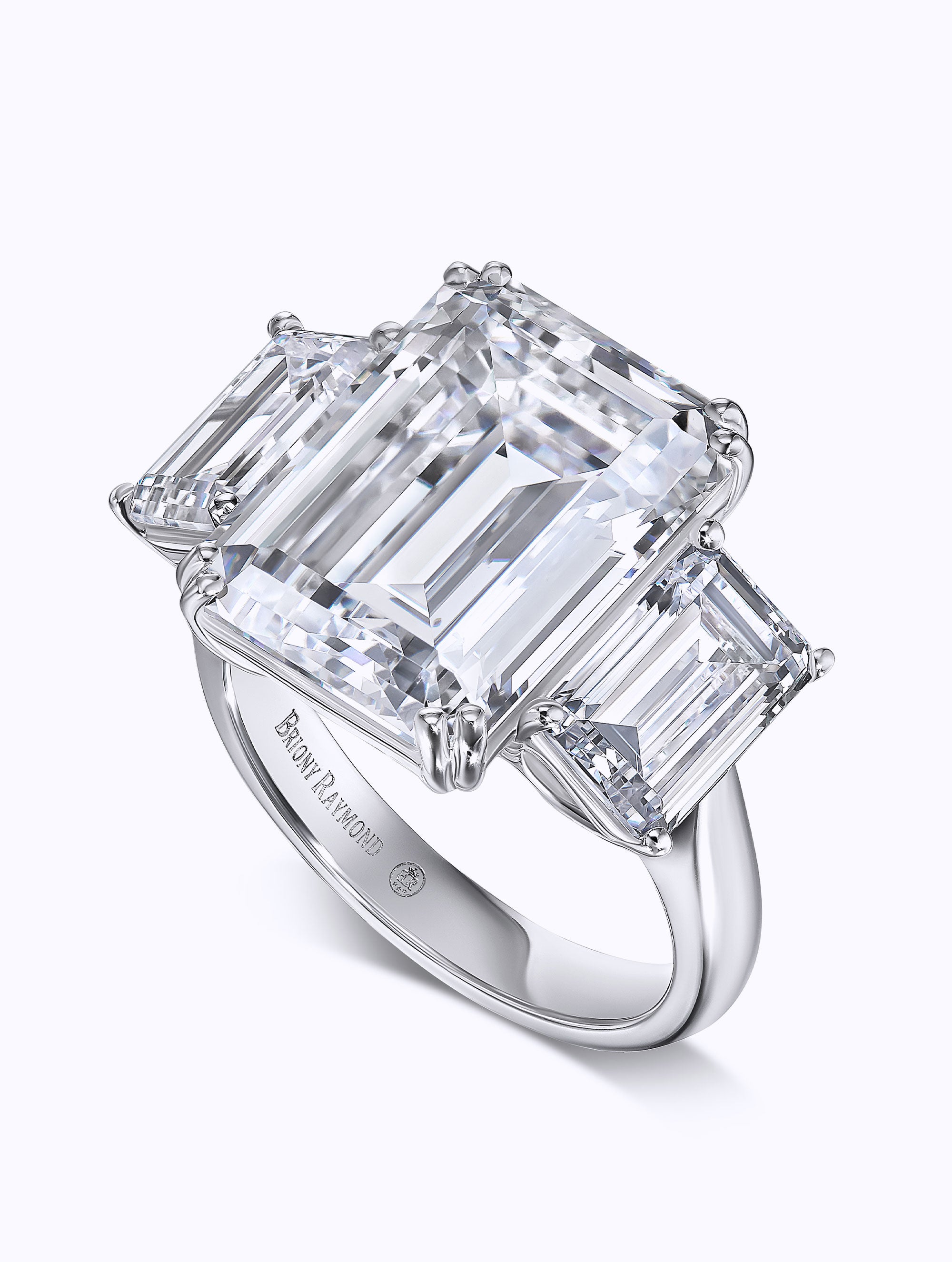 THREE STONE EMERALD CUT DIAMOND RING